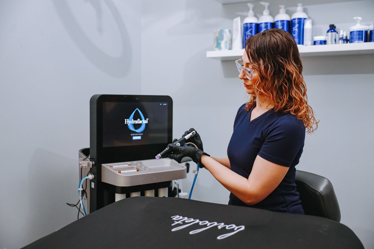 Smiling professional preparing for a cosmetic procedure.