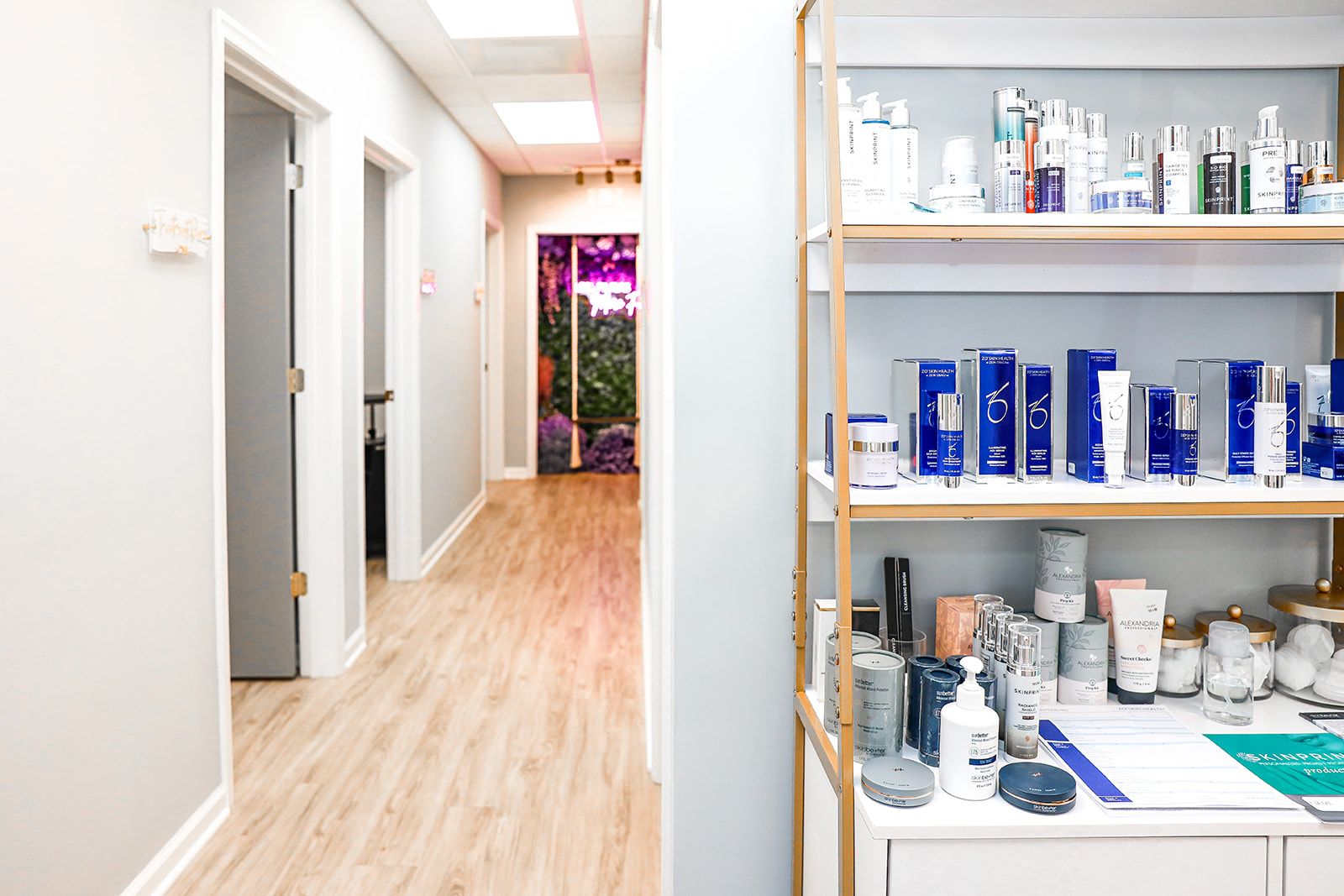 Spa hallway with skincare products displayed.