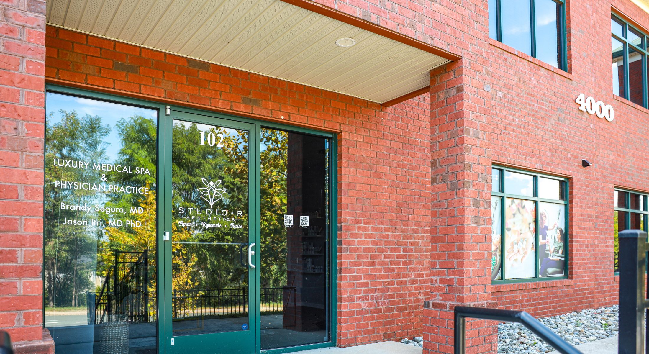 Luxury medical spa entrance with branding details.