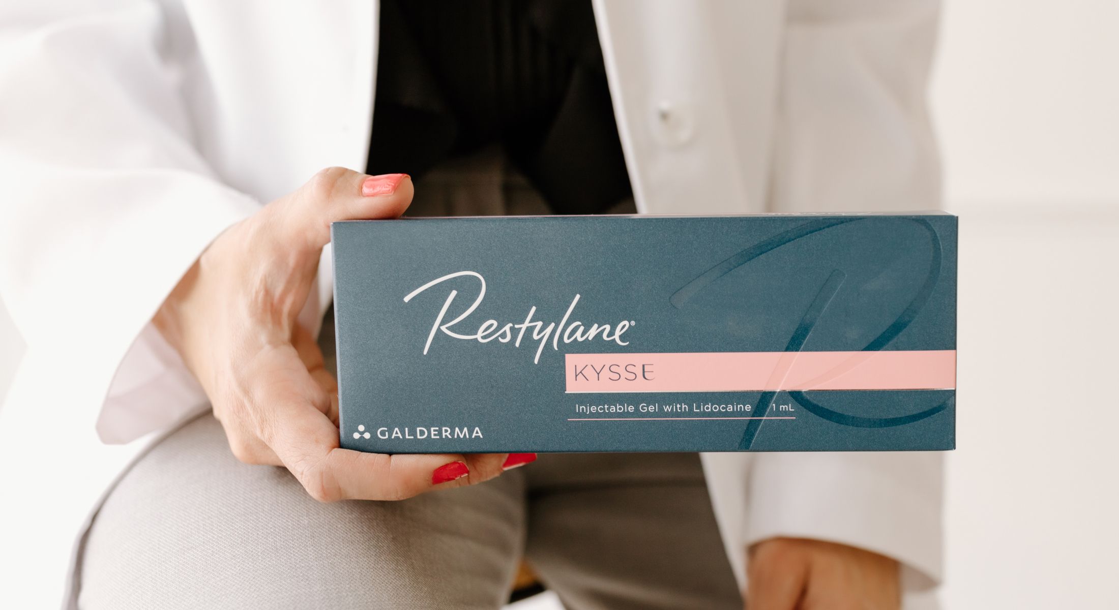 Restylane Kysse injectable gel packaging held by hand