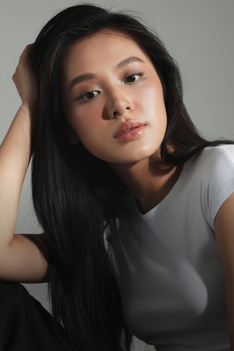 Portrait of a young woman with long hair.