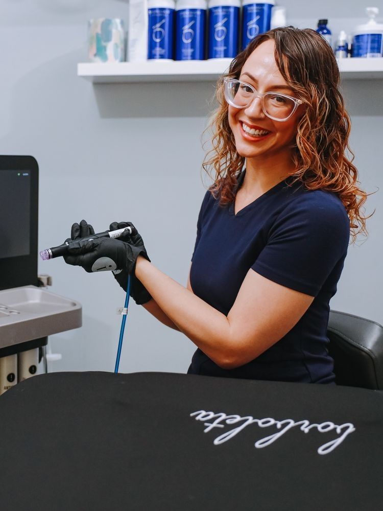 Smiling professional preparing for a cosmetic procedure.